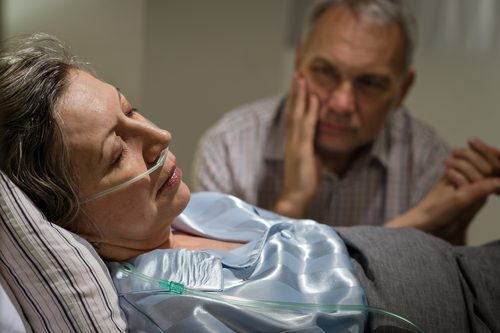 Photo of sick elderly woman in hospital