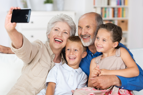 Photo of grandparents enjoying time with their grandchildren